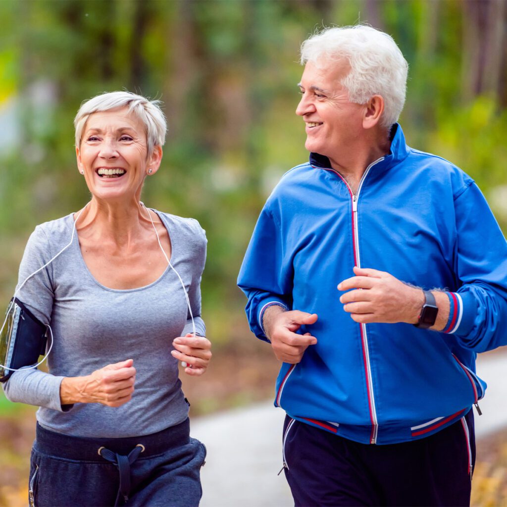 elderly couple running