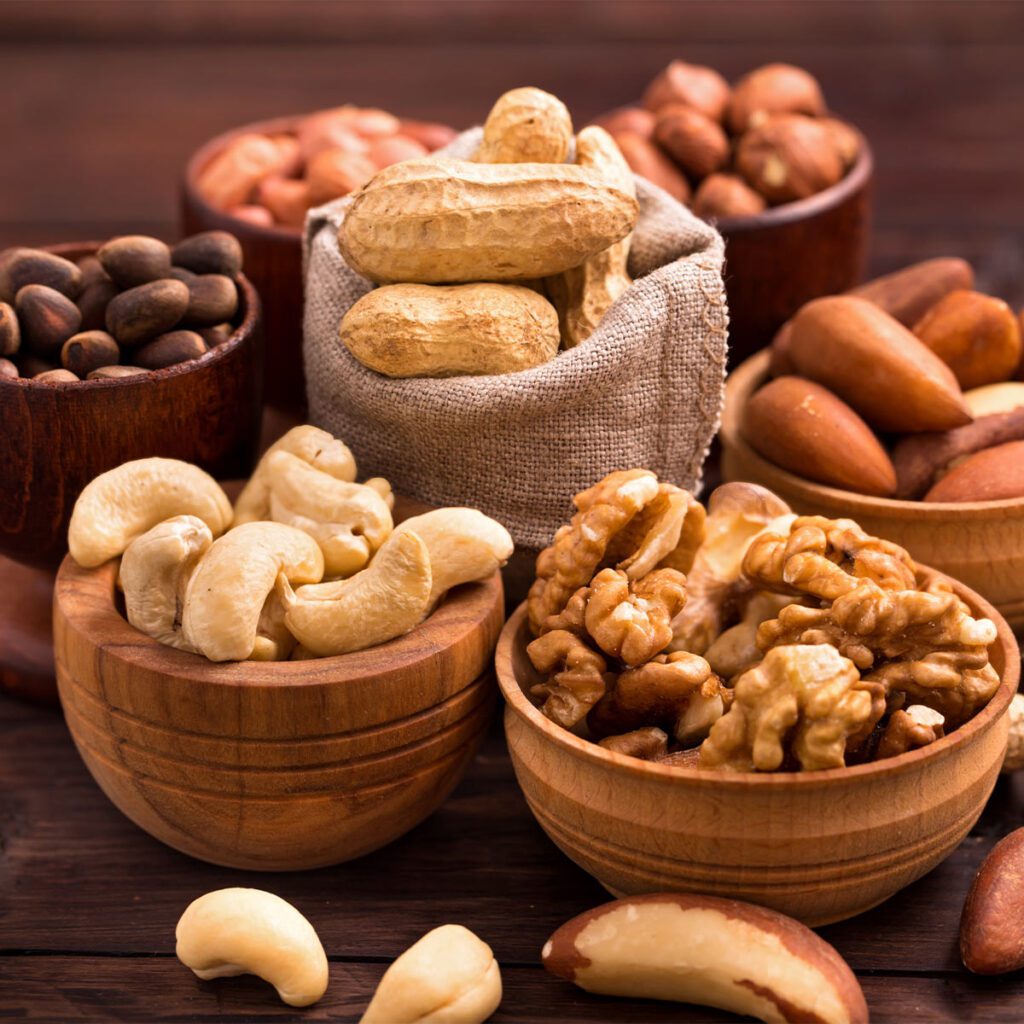 assorted nuts separated in bowls