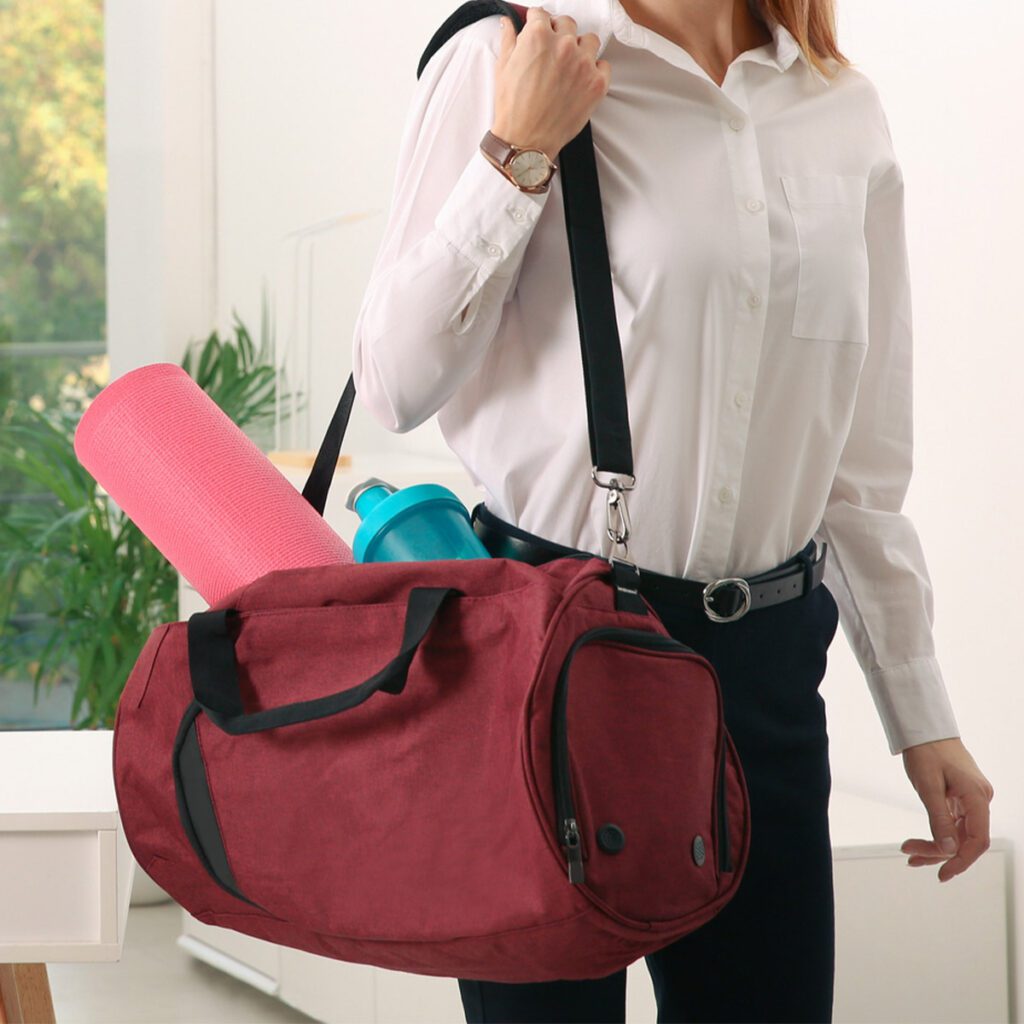 business woman holding a gym bag