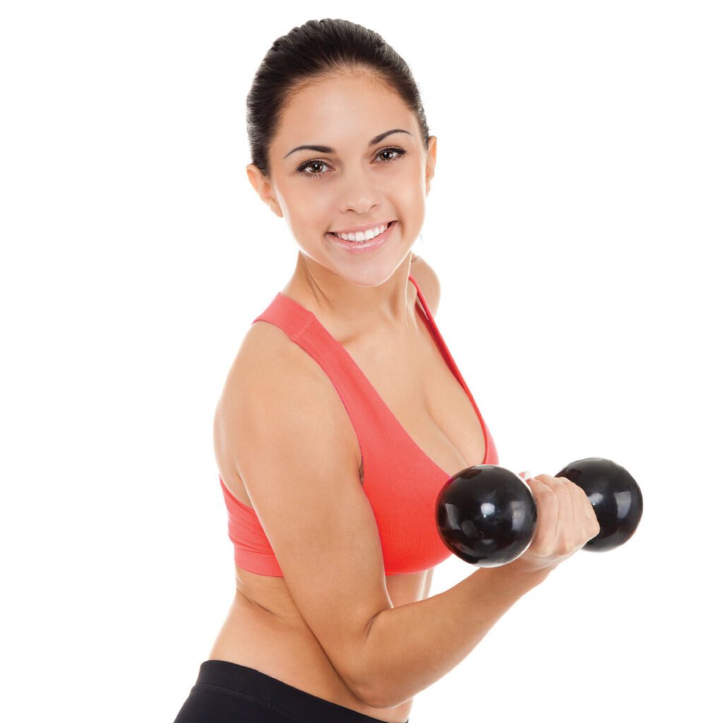smiling woman holding a dumbbell