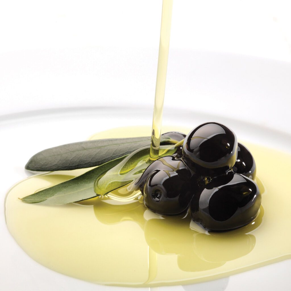 plate of olive oil with olives