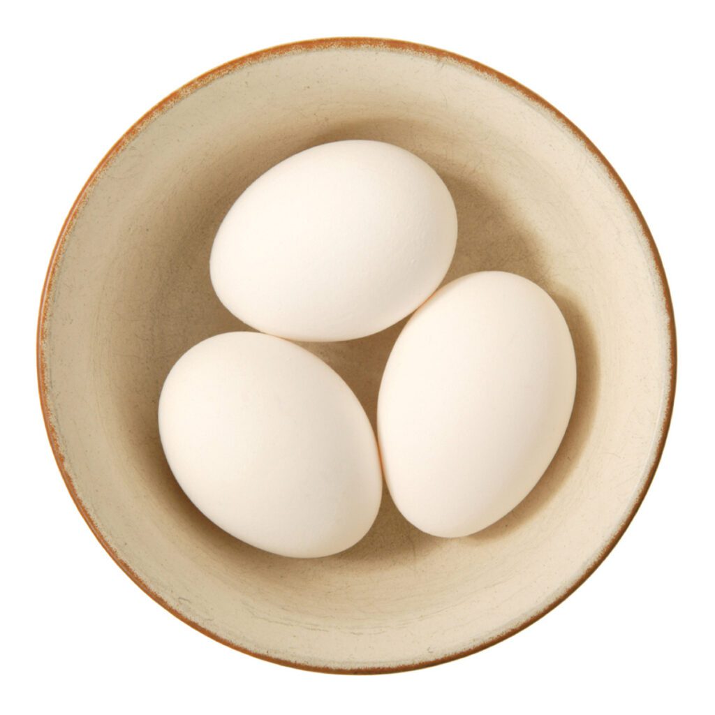 three eggs in a bowl