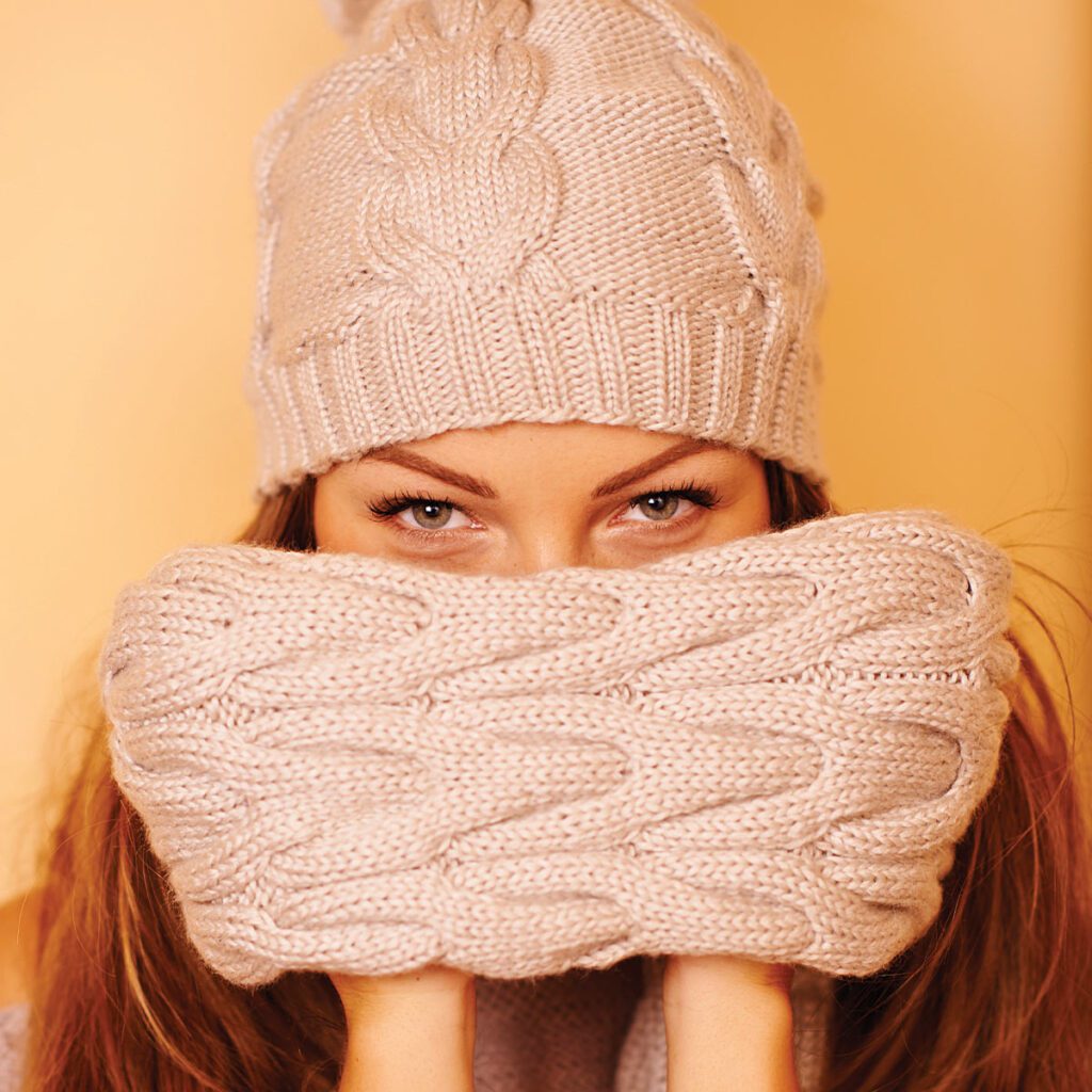 woman bundled in a scarf and beanie