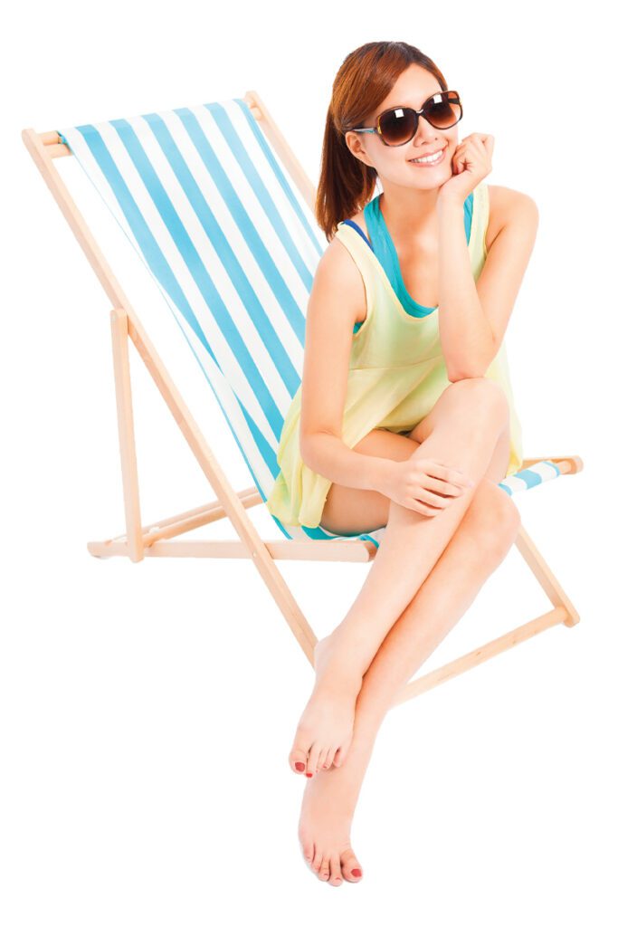 smiling woman sitting on a folding chair