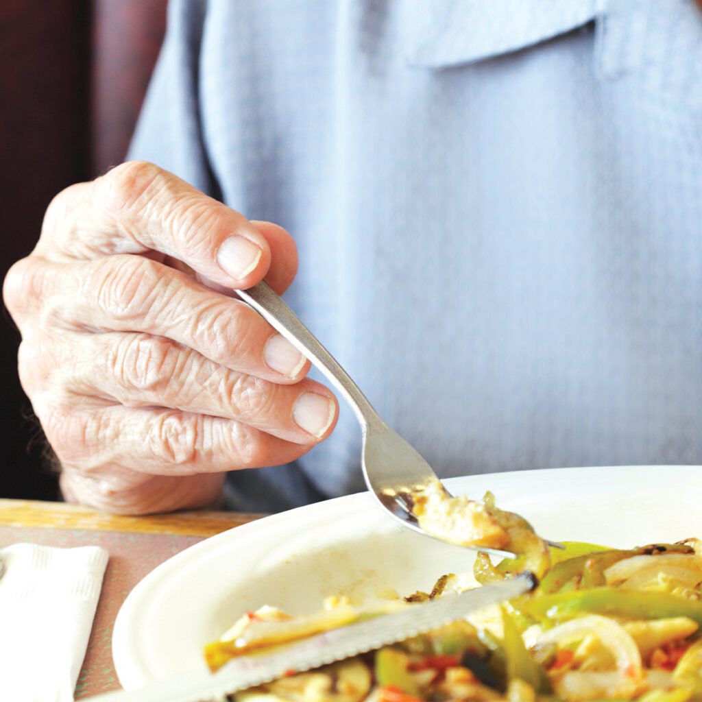 elderly man eating