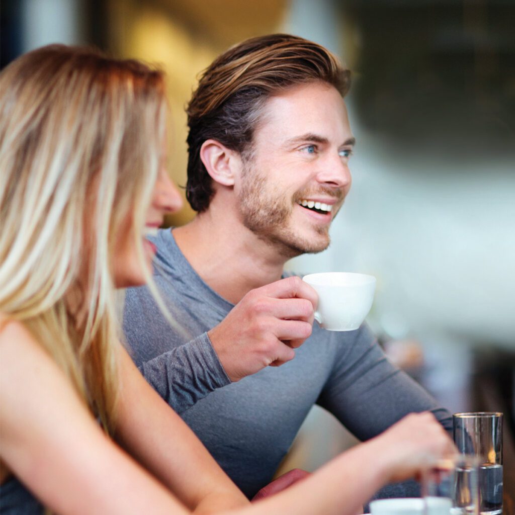 man and woman enjoying their time in a restaurant