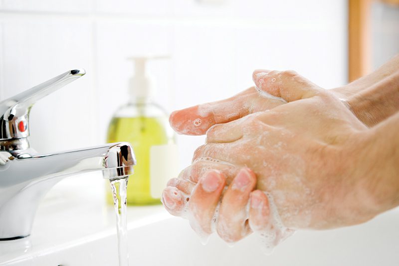 washing hands with running water