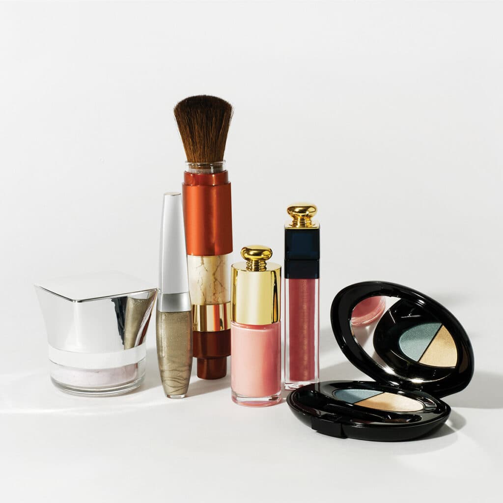 makeup products standing in gray background