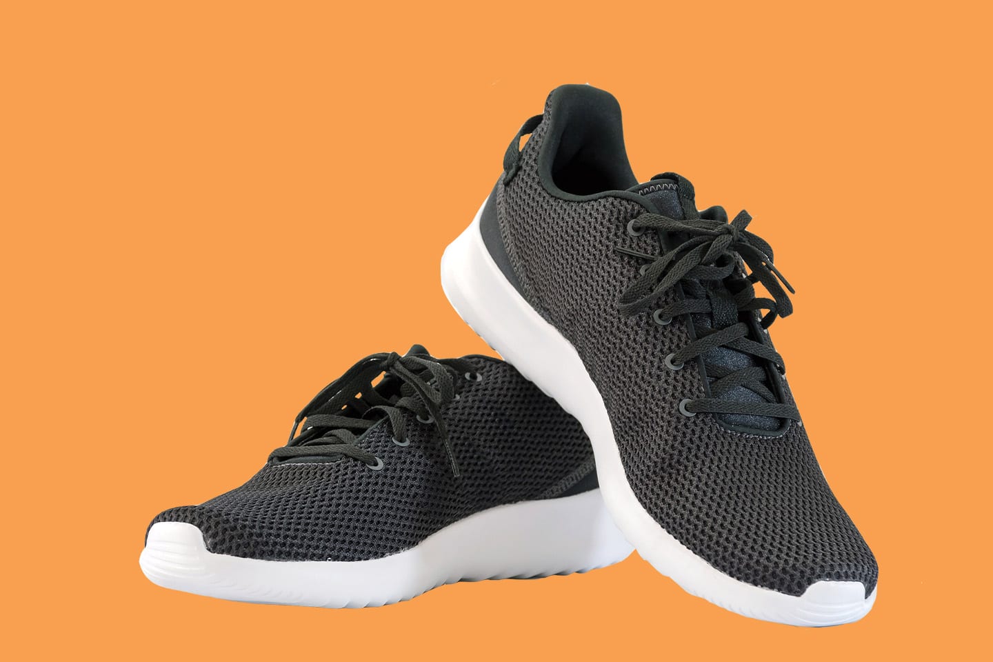 black and white running shoes on orange background chattanooga