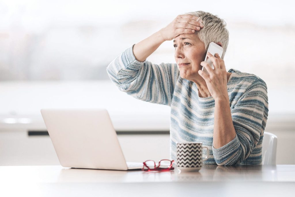 hypochondriac woman googling her symptoms and calling her doctor