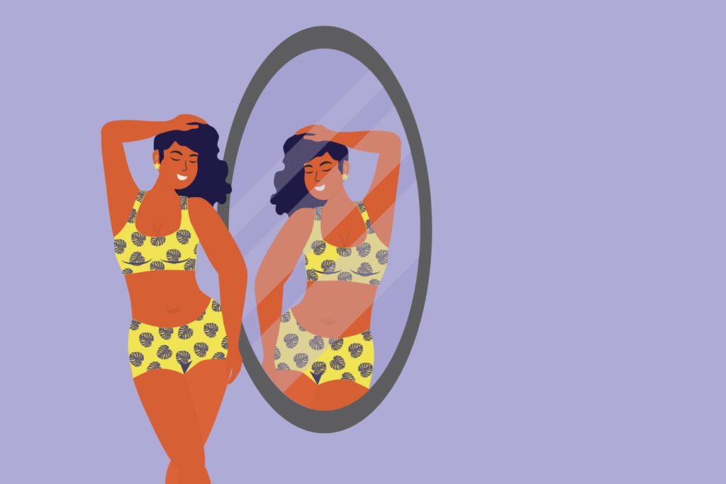 Happy curvy woman looks into mirror