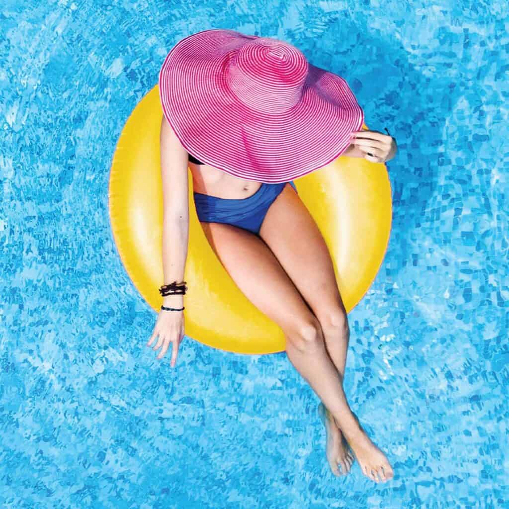 health in a minute late summer 2022 | woman in yellow inflatable in swimming pool