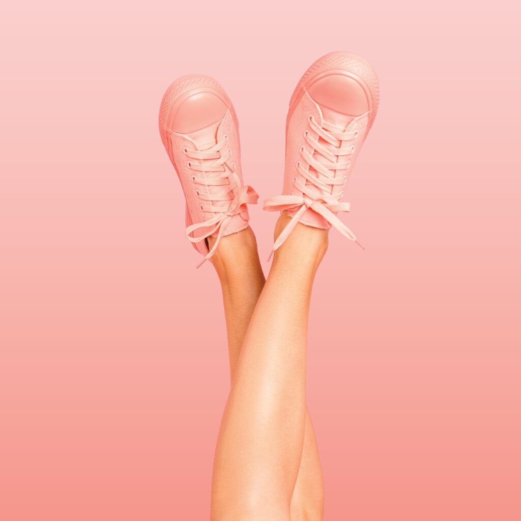 pink tennis shoes in pink background