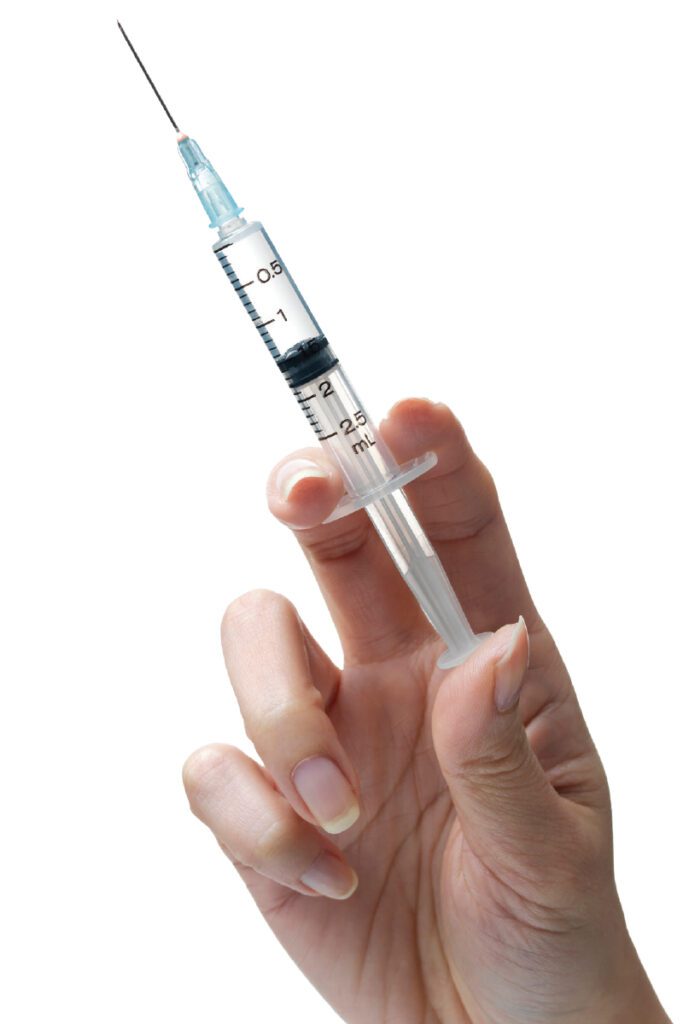 hand holding syringe