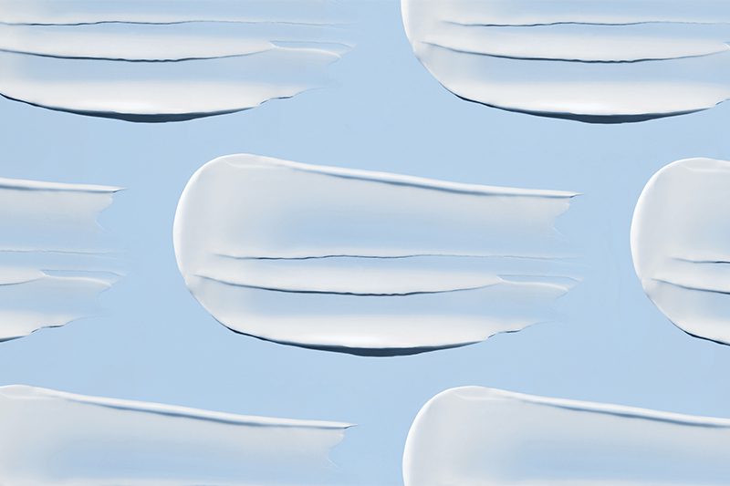 photo of moisturizer swipes on blue background