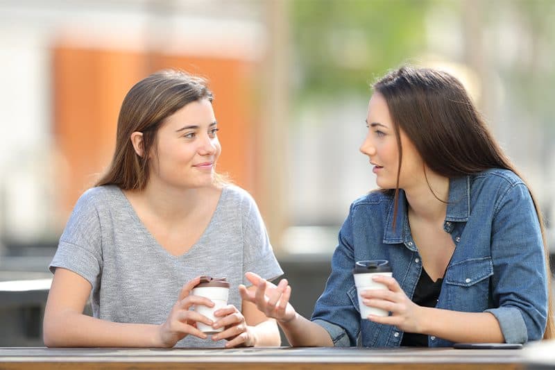 female friends conversing together in public