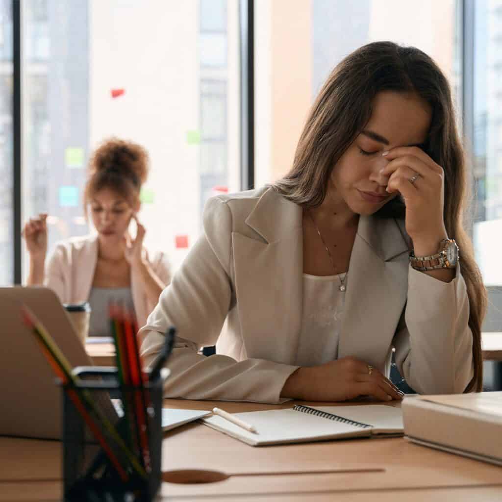 woman exhausted of her toxic coworker