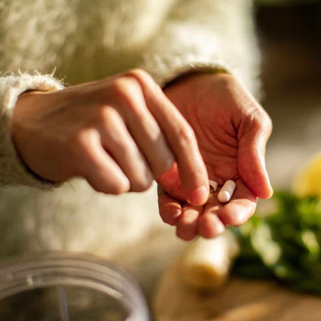 woman taking magnesium glycinate