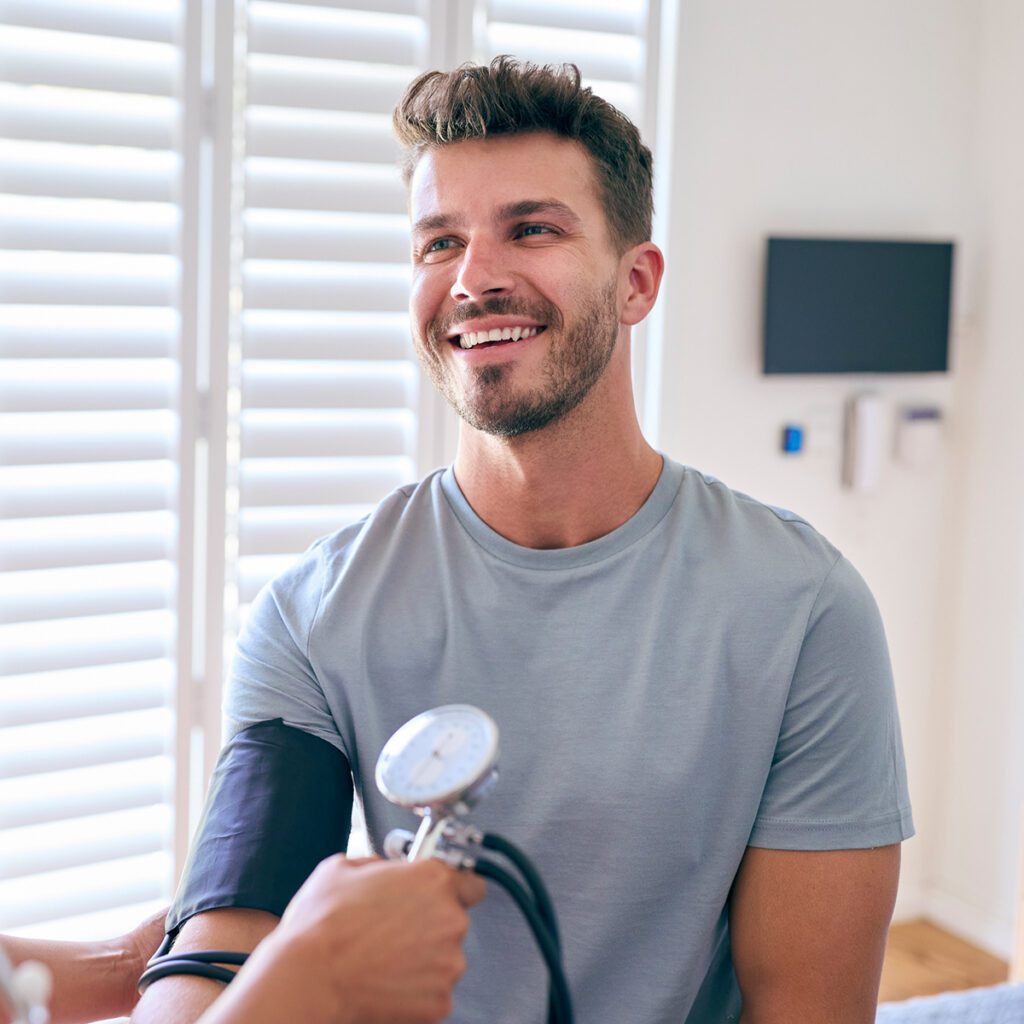 man getting his blood pressure checked