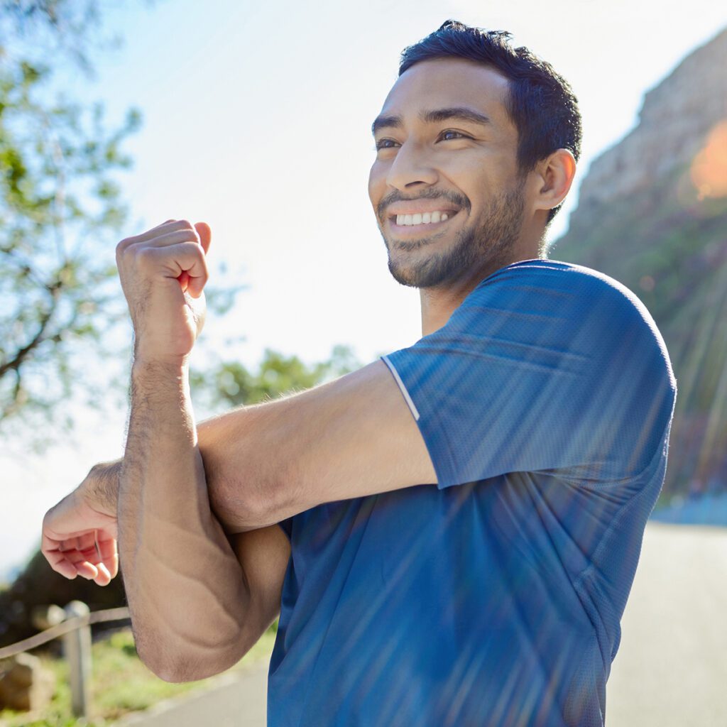 healthy guy stretching before run